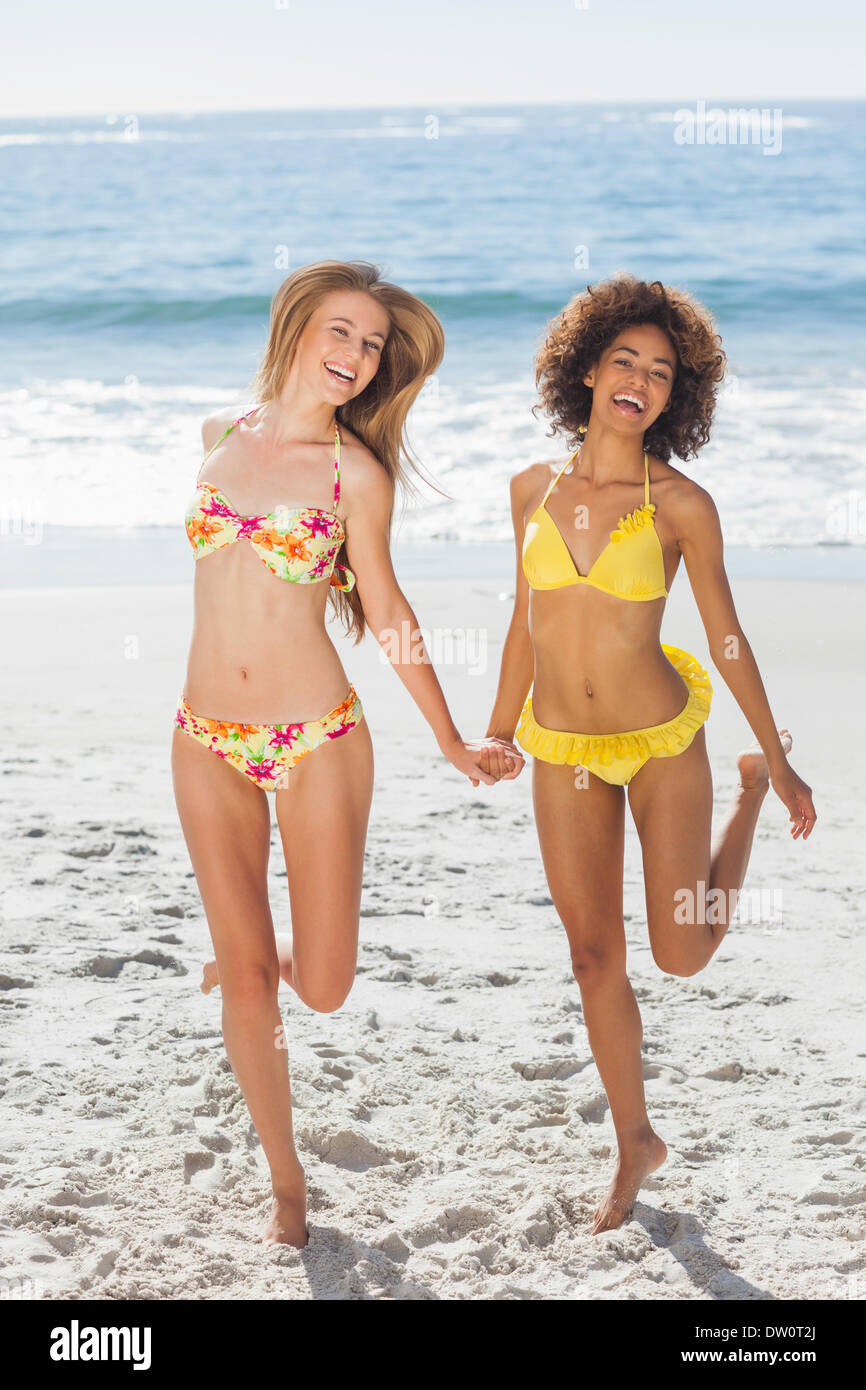 Happy women having fun on the beach Stock Photo
