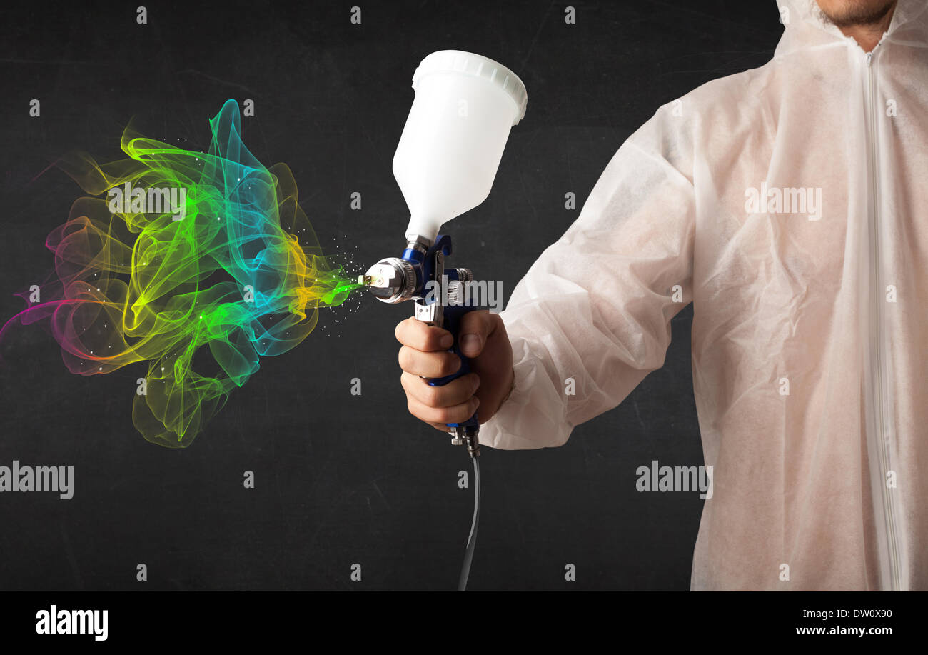 Paint Working Painter working with airbrush and paints colorful paint Stock Photo - Alamy
