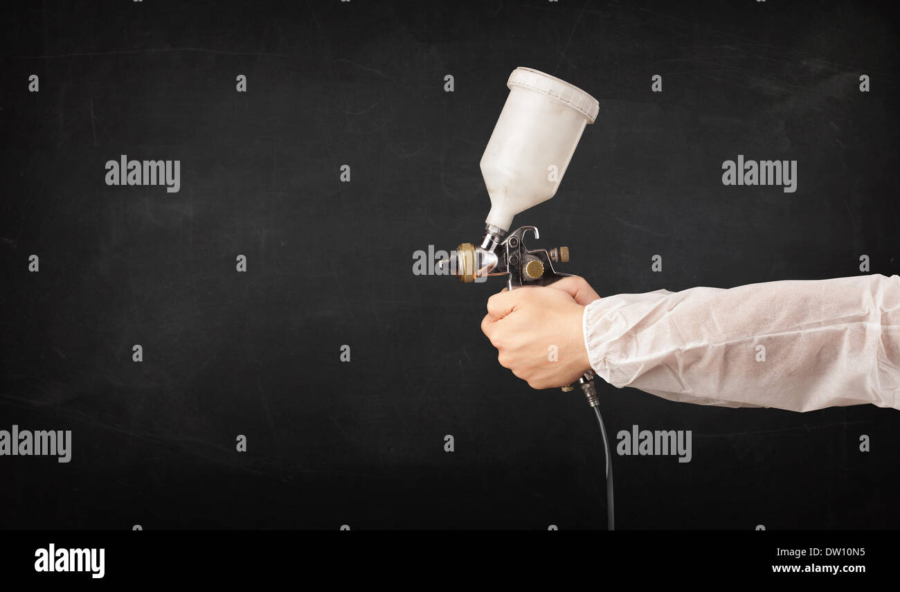 Painter works with airbrush gun and empty copyspace Stock Photo Alamy