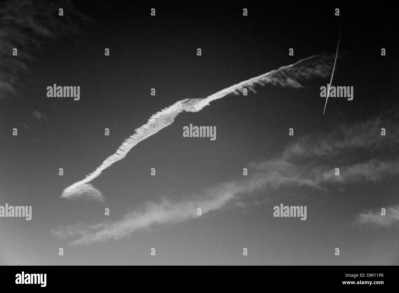 Black & white view of jet contrails and sunset sky in Colorado, USA Stock Photo