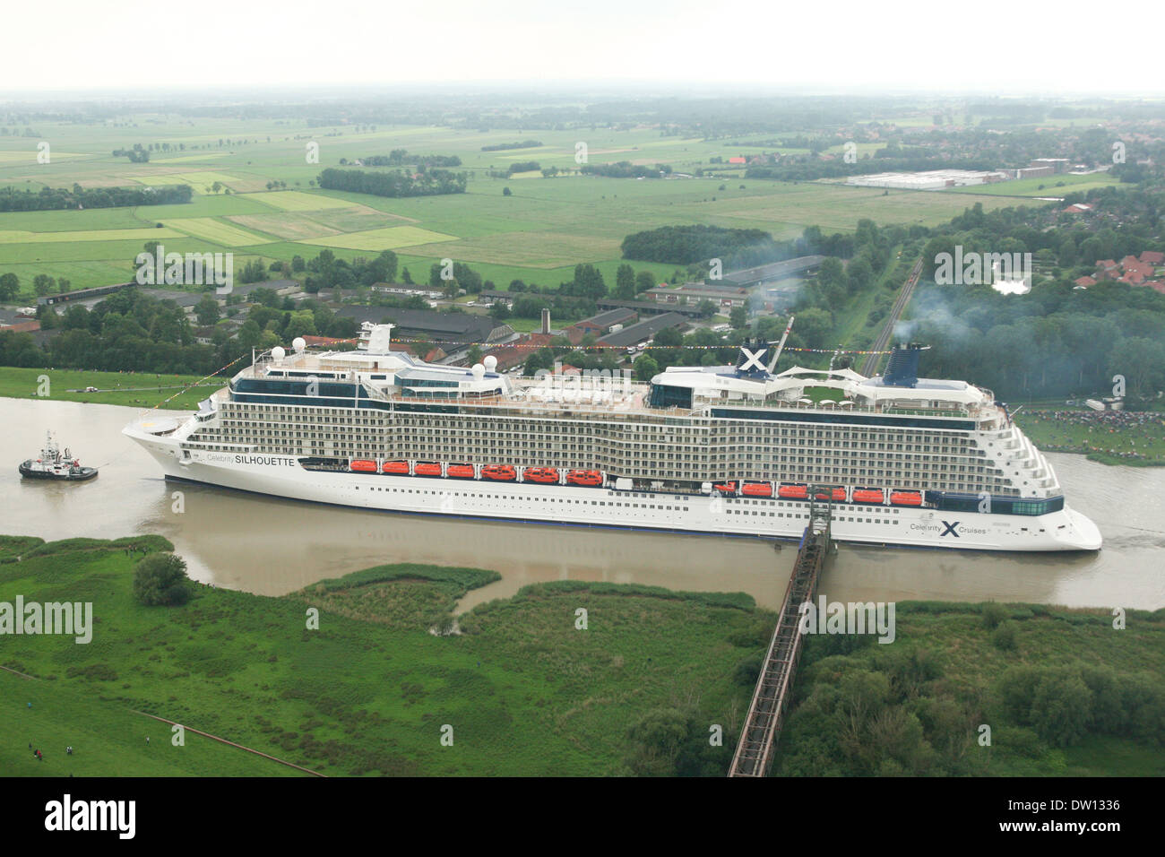Cruise ship Celebrity Silhouette leaves the shipyard in Papenburg, where she was built and is floated backwards to the sea. Stock Photo
