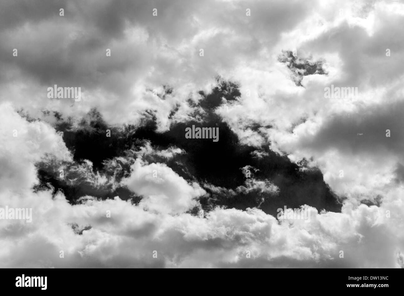 Black & white view of wispy white clouds against clear Colorado sky Stock Photo