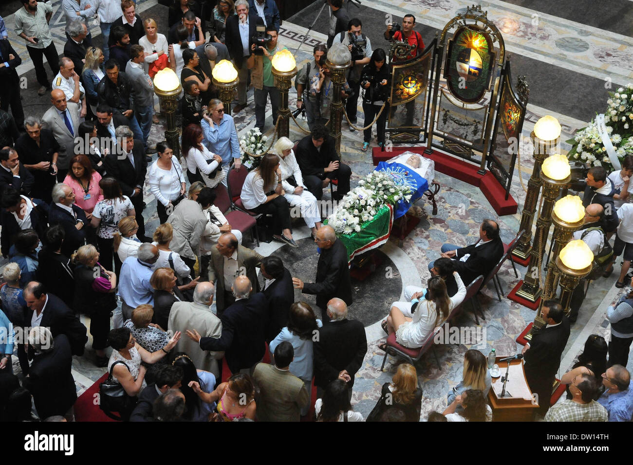 Montevideo, Uruguay. 25th Feb, 2014. People attend the funeral of Uruguayan artist Carlos Paez Vilaro, in the Hall of Lost Steps of Legislative Palace in Montevideo, Uruguay, on Feb. 25, 2014. Carlos Paez Vilaro died of heart attack at the age of 90 on Monday morning in Casapueblo, a citadel-sculpture created by the artist himself that includes a museum, an art gallery and the Hotel Casapueblo. Credit:  Nicolas Celaya/Xinhua/Alamy Live News Stock Photo