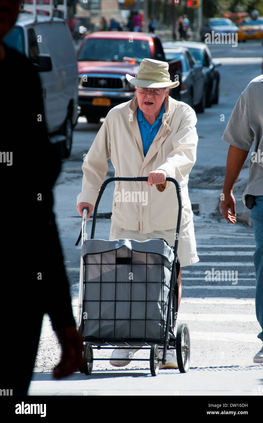 Man pushing grocery cart Stock Photo