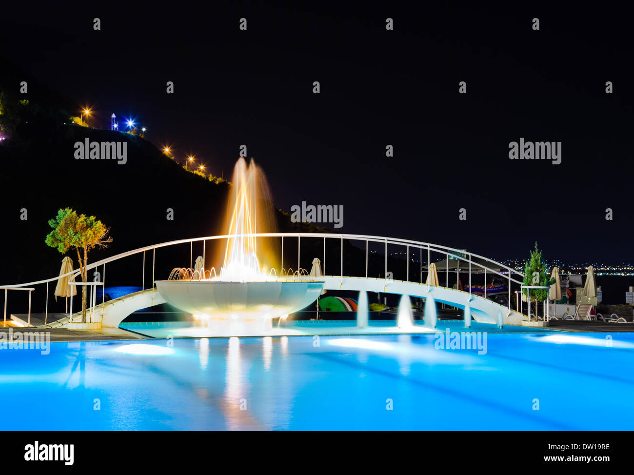 Water pool and fountain at night Stock Photo - Alamy