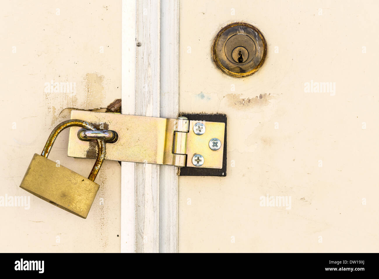 Old key lock on white door Stock Photo Alamy