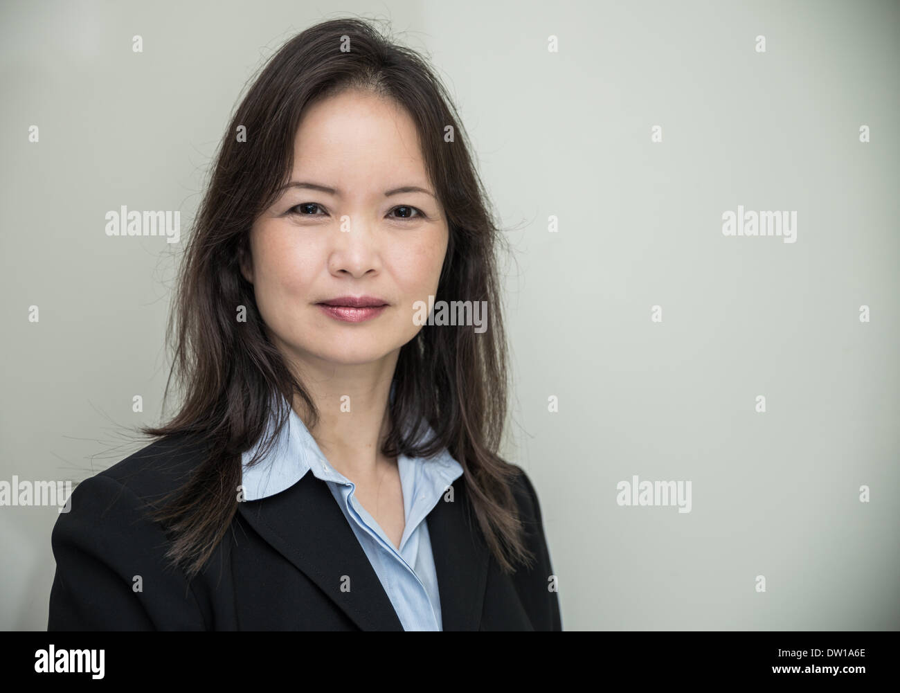 Portrait of woman in business suit Stock Photo - Alamy