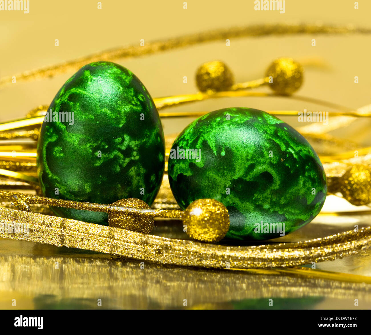 Easter eggs with golden leaves Stock Photo