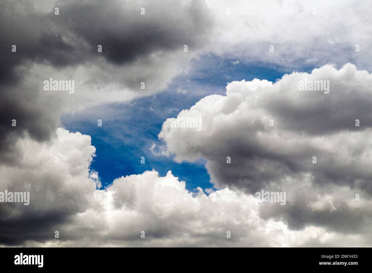 Wispy white clouds against a clear blue azure Colorado sky Stock Photo