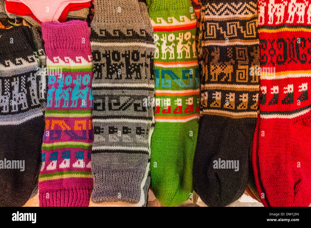 Colorful Bolivian socks on display for sale in a vendor's stall in the La Cancha market in Cochabamba, Bolivia. Stock Photo