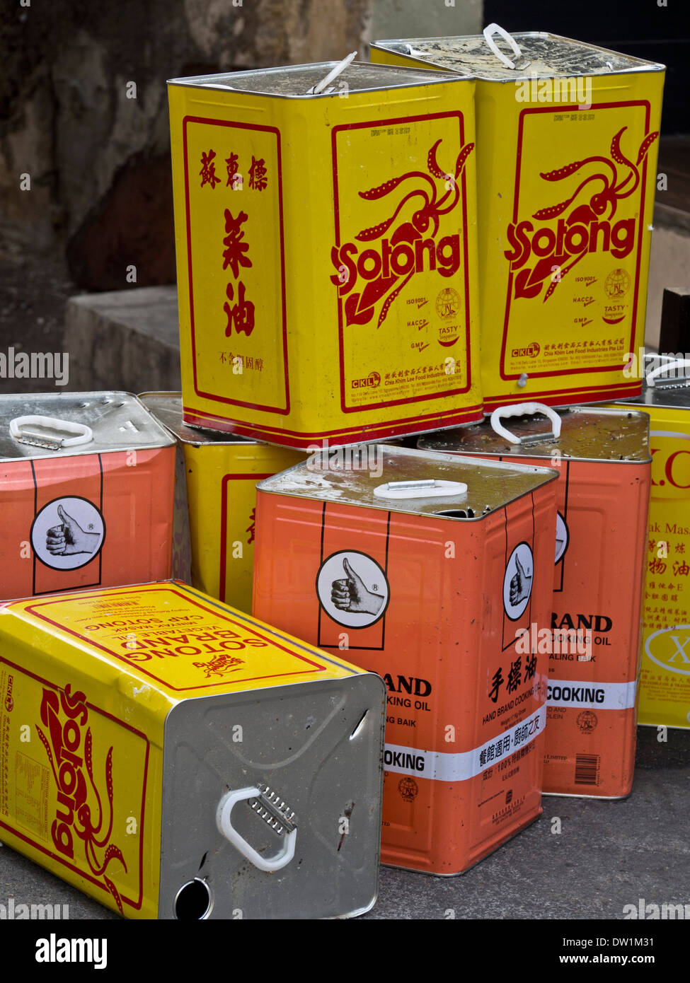 Cans of cooking oil by restaurants in Little India, Singapore Stock