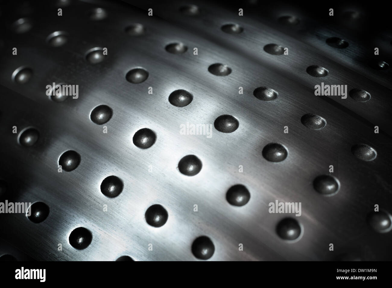 spherical metal surface background with holes Stock Photo - Alamy