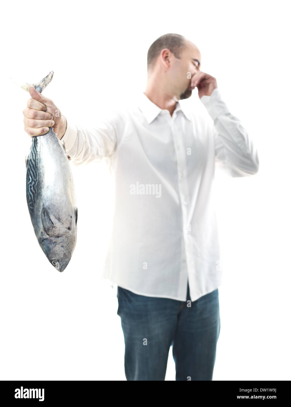 man with smelly fish Stock Photo