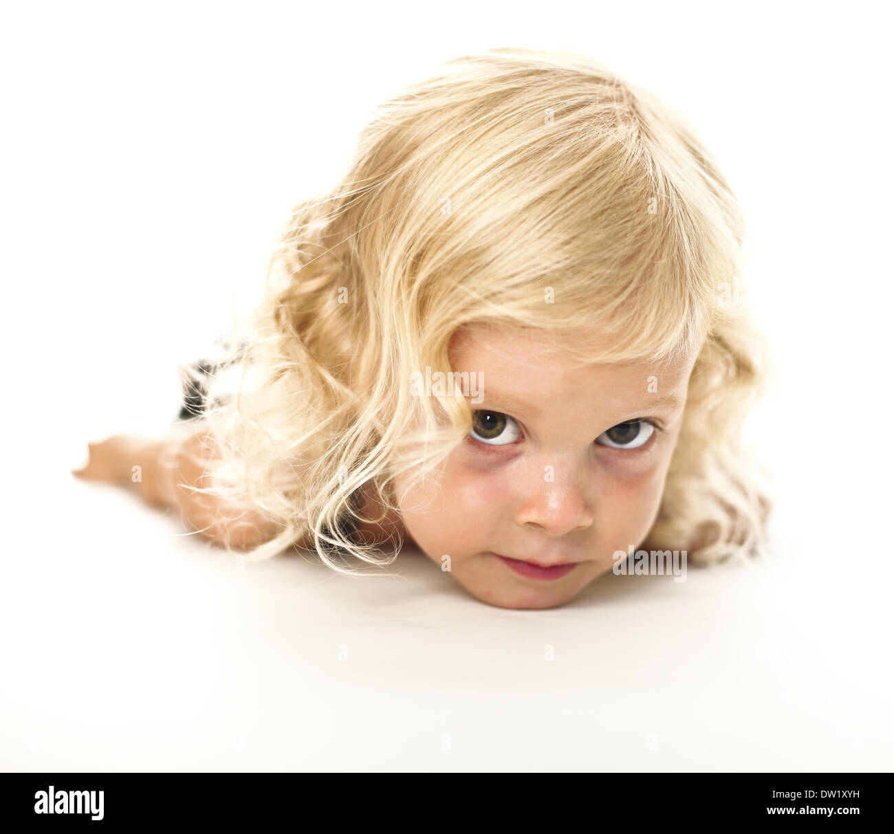 funny lay down blonde kid Stock Photo