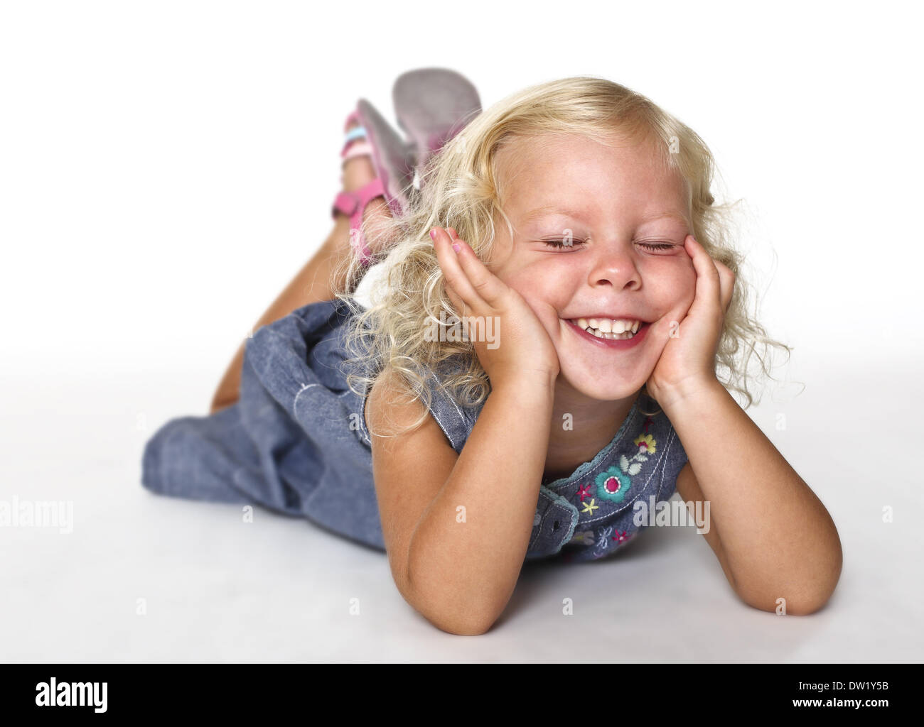 kid lay down on white Stock Photo