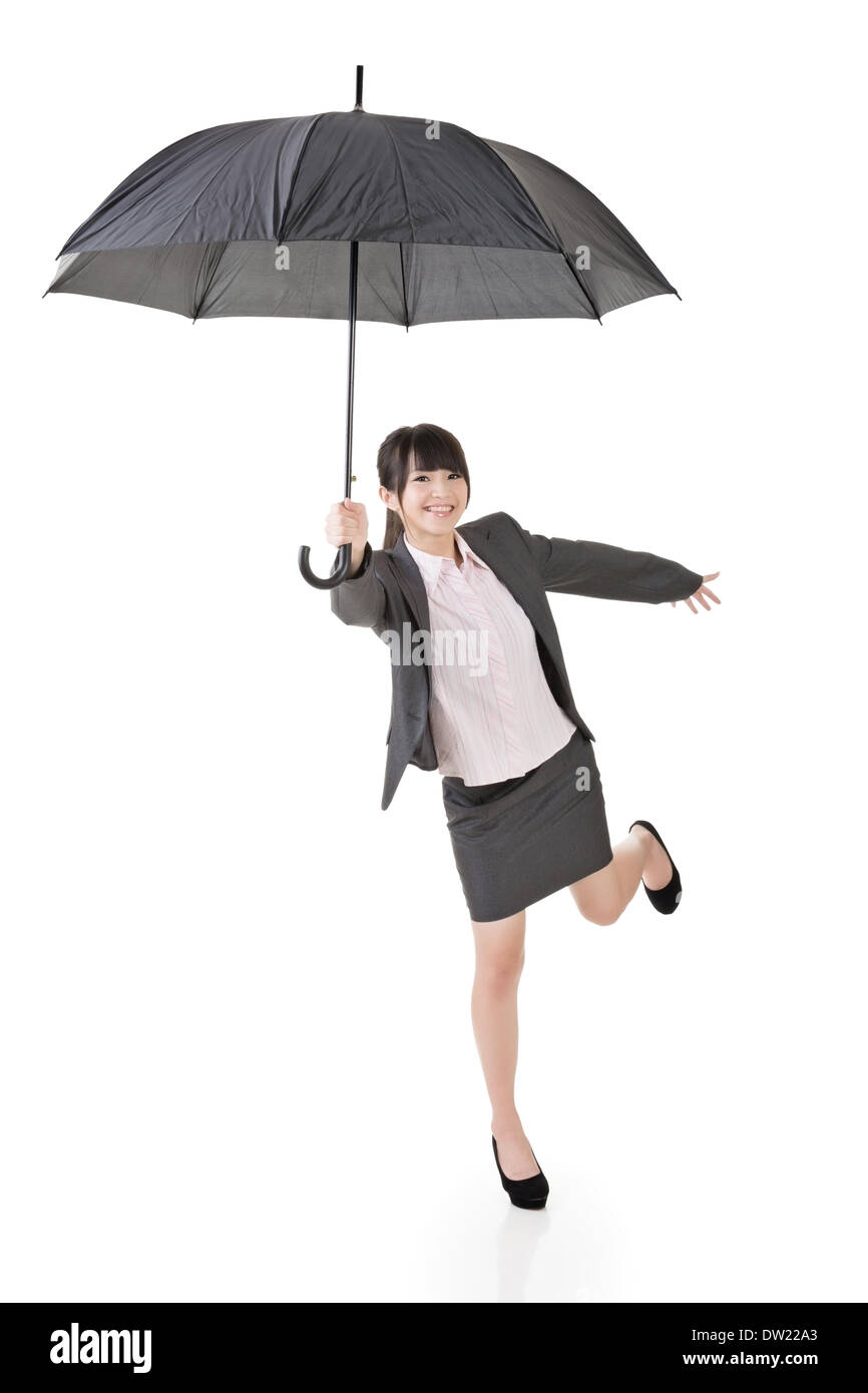 Asian business woman holding umbrella. Stock Photo
