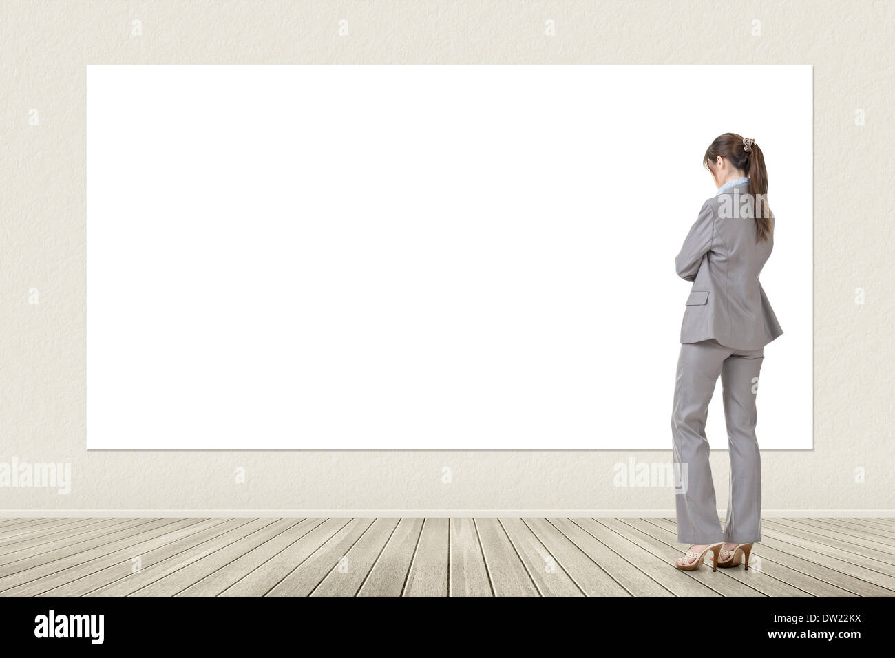 Asian business woman looking at blank banner Stock Photo