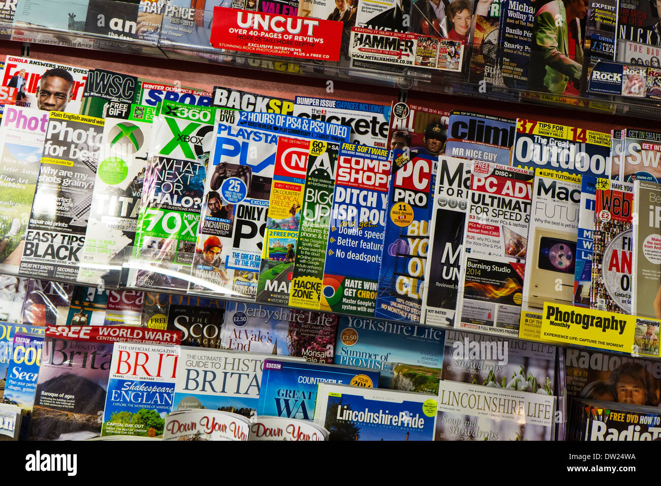 Magazine display stand in stationary shop store computer games mags mag selling Stock Photo