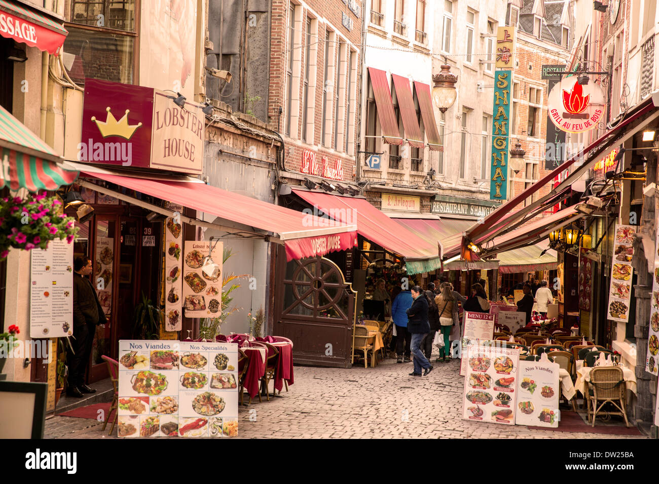Restaurants lining Rue des Bouchers in Brussels Belgium Stock Photo