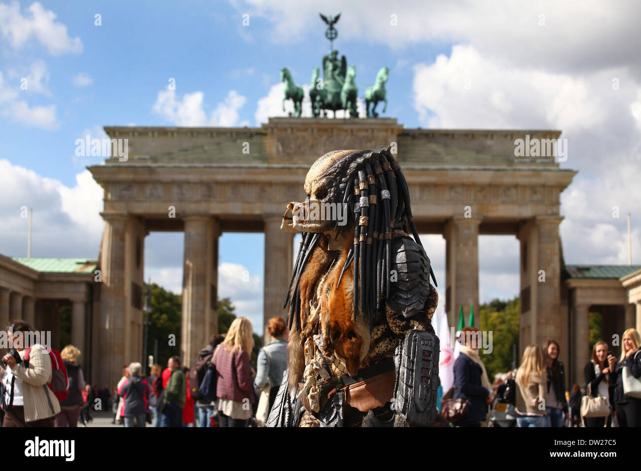 A man dressed up as a monster waits for tourists at the Brandenburg Gate in Berlin, September, 17, 2013. More and more tourists come Berlin. The photo is part of a series on tourism in Berlin. Photo. Wolfram Steinberg dpa Stock Photo