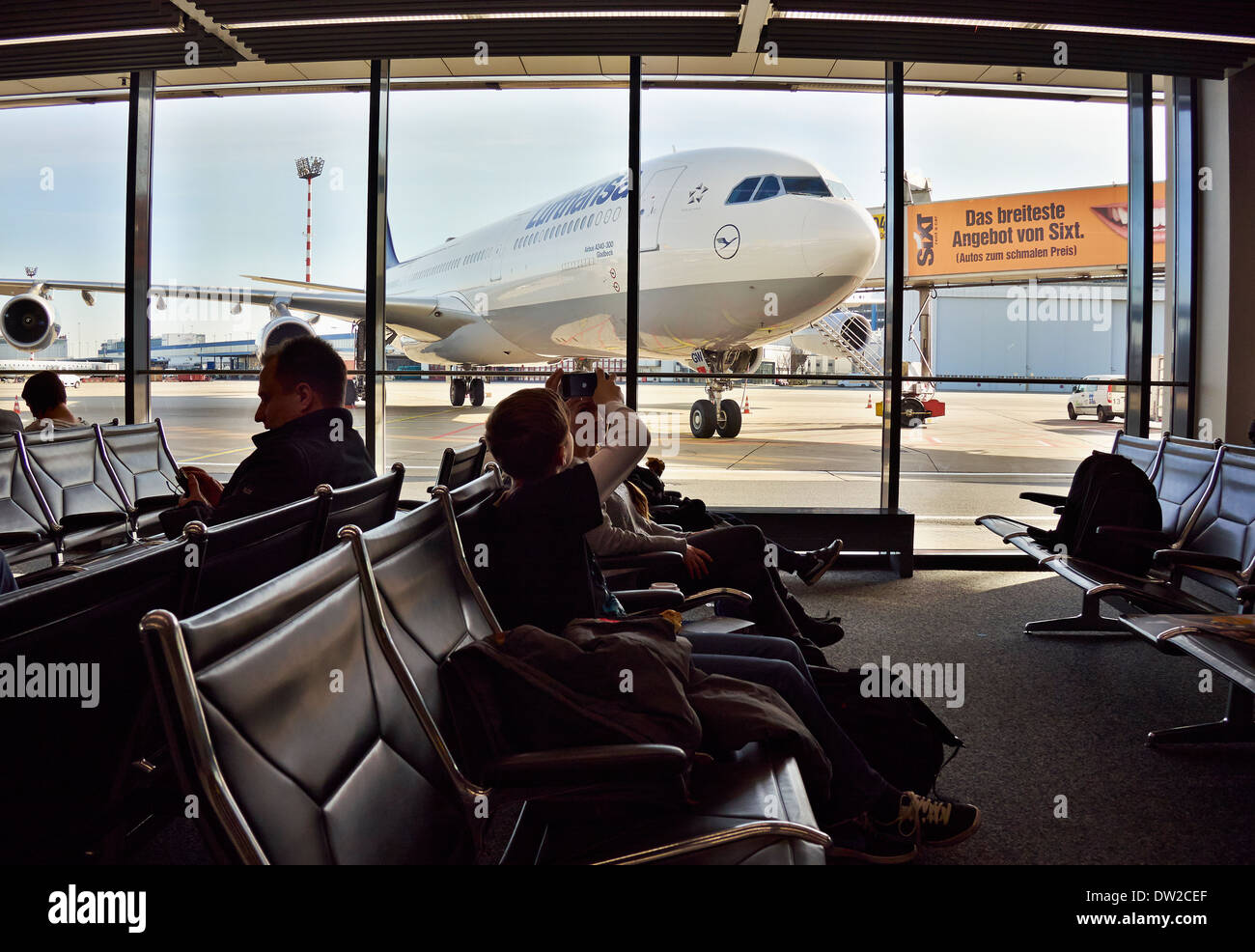 Waiting room passengers in airport hi-res stock photography and images ...