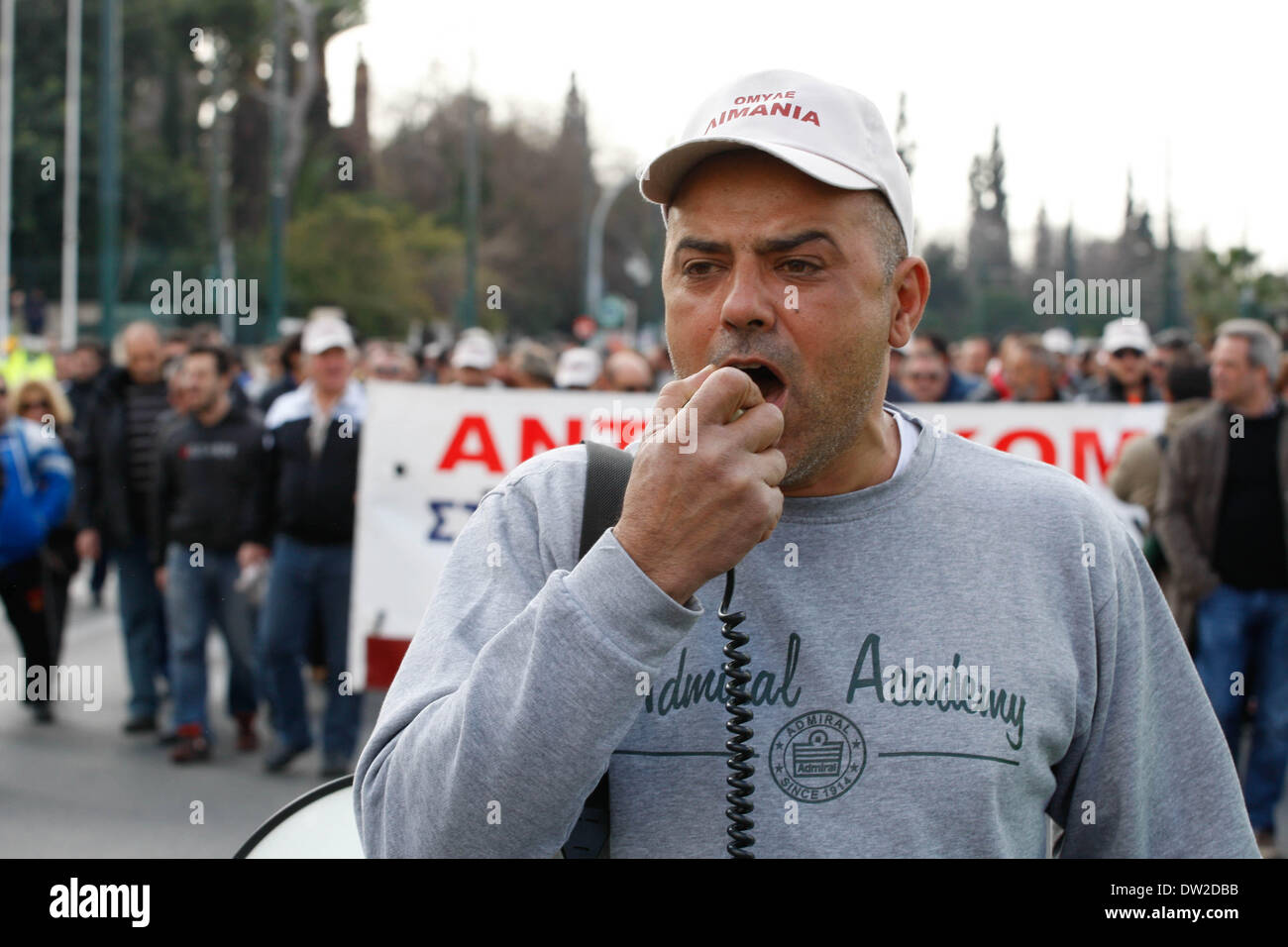 Athens, Greece. 26th Feb, 2014. Greek dock workers in a 24-hour strike to protest plans to sell stakes in the Piraeus Port Authority, the country's largest port.Privatizing state-held assets is a critical part of Greece's international bailout agreement, under which the country has received billions of dollars in rescue loans from other European Union countries that use the euro currency, and from the International Monetary Fund. Credit:  Aristidis Vafeiadakis/ZUMAPRESS.com/Alamy Live News Stock Photo