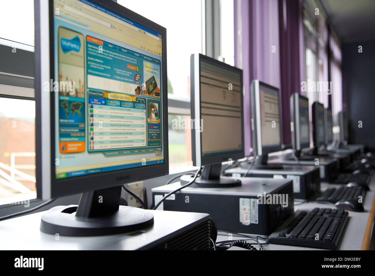 ICT suite in a UK primary school with a bank of desktop computers Stock Photo