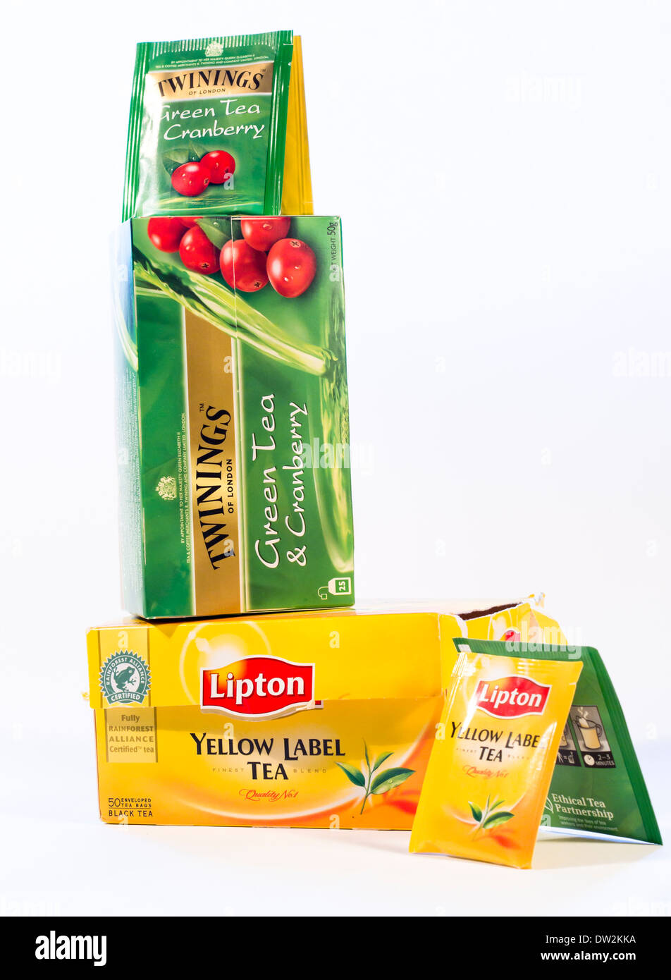 Lipton or Twining, black tea or green tea, yellow or green boxes and teabags on white background Stock Photo