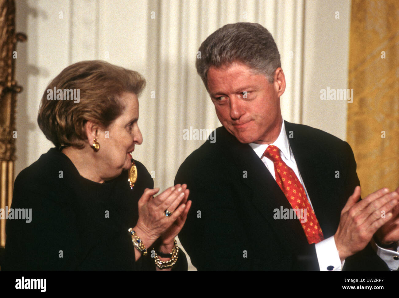 US President Bill Clinton speaks with Secretary of State Madeline Albright during a event at the White House March 11, 1998 in Washington, DC. Stock Photo