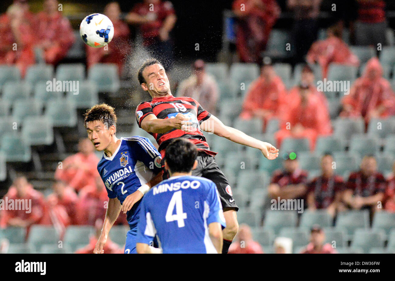 Sydney, Australia. 26th Feb, 2014. Wanderers forward Mark Bridge and Ulsan defender Lee Yong in action during the AFC Champions League game between Western Sydney Wanderers FC and Ulsan Hyundai FC of Korea from the Pirtek Stadium, Parramatta. Ulsan won 3-1. Credit:  Action Plus Sports/Alamy Live News Stock Photo