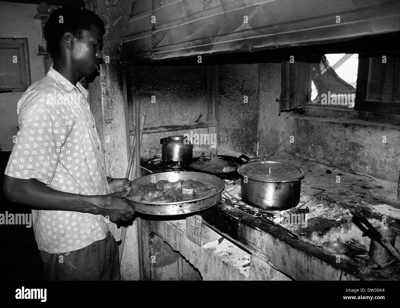 A Somali cook preparing lunch at the MSF hospital compound in Kismayo Somalia circa 1993 Stock Photo