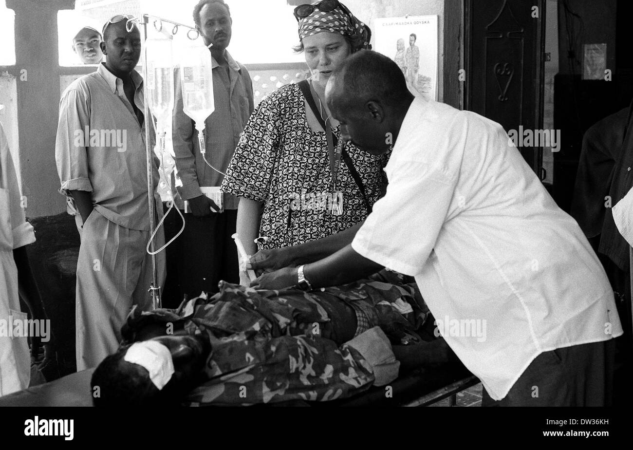 MSF nurse watches over a wounded solider in Galkayo Hospital Somalia Stock Photo