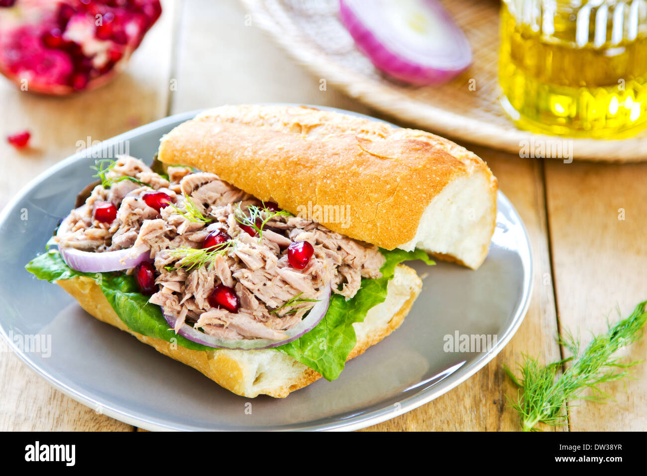 Tuna with Dill and Pomegranate on Baguette sandwich Stock Photo Alamy