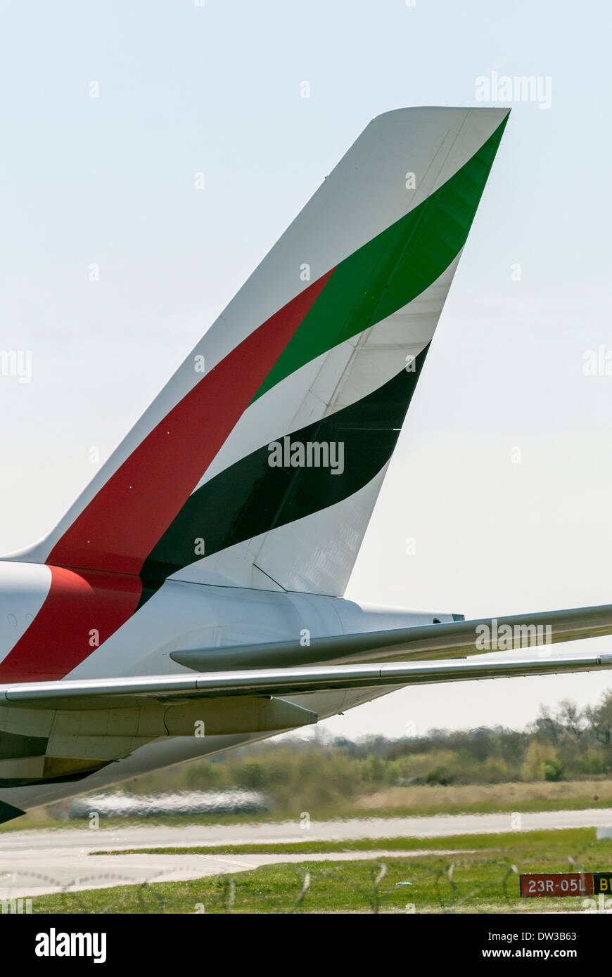 The tail fin of an A380 Airbus and Emirates Airlines at Manchester Airport, England, UK Stock Photo