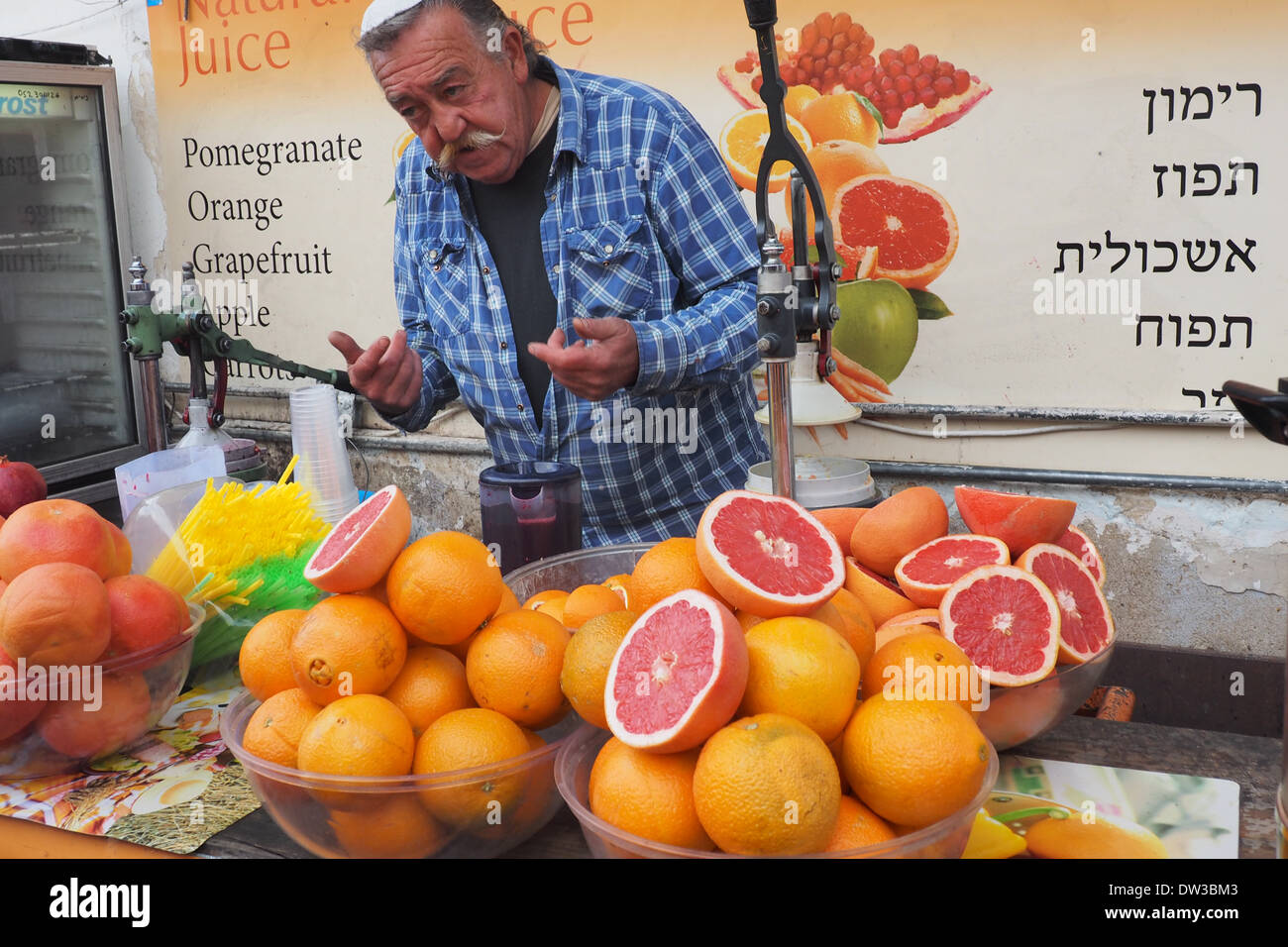 Man selling fresh fruit juice in Safed Israel Stock Photo