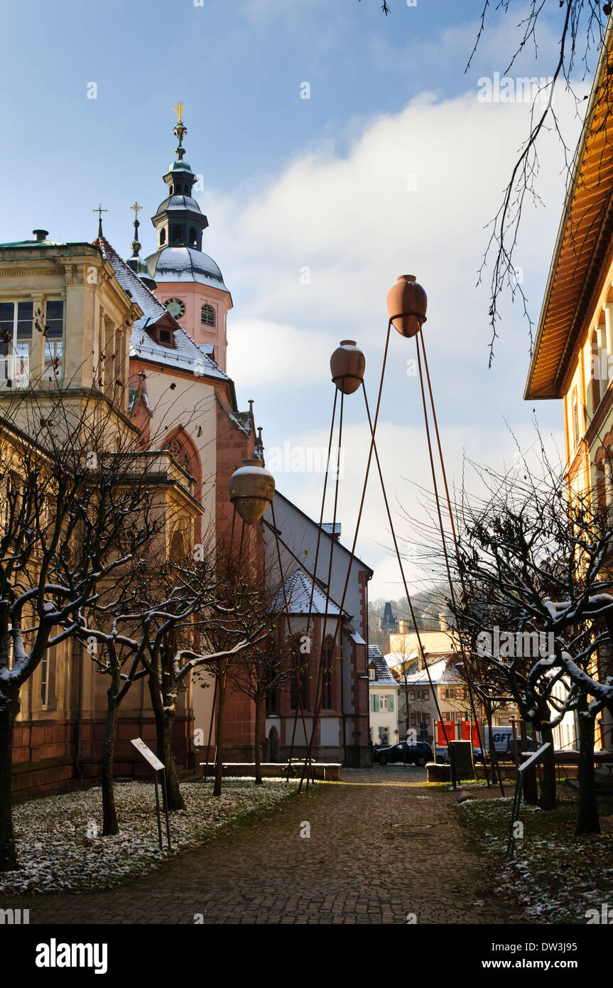 Public artworks in a cobbled street near the Stiftskirche in Baden-Baden, southern Germany. December. Stock Photo