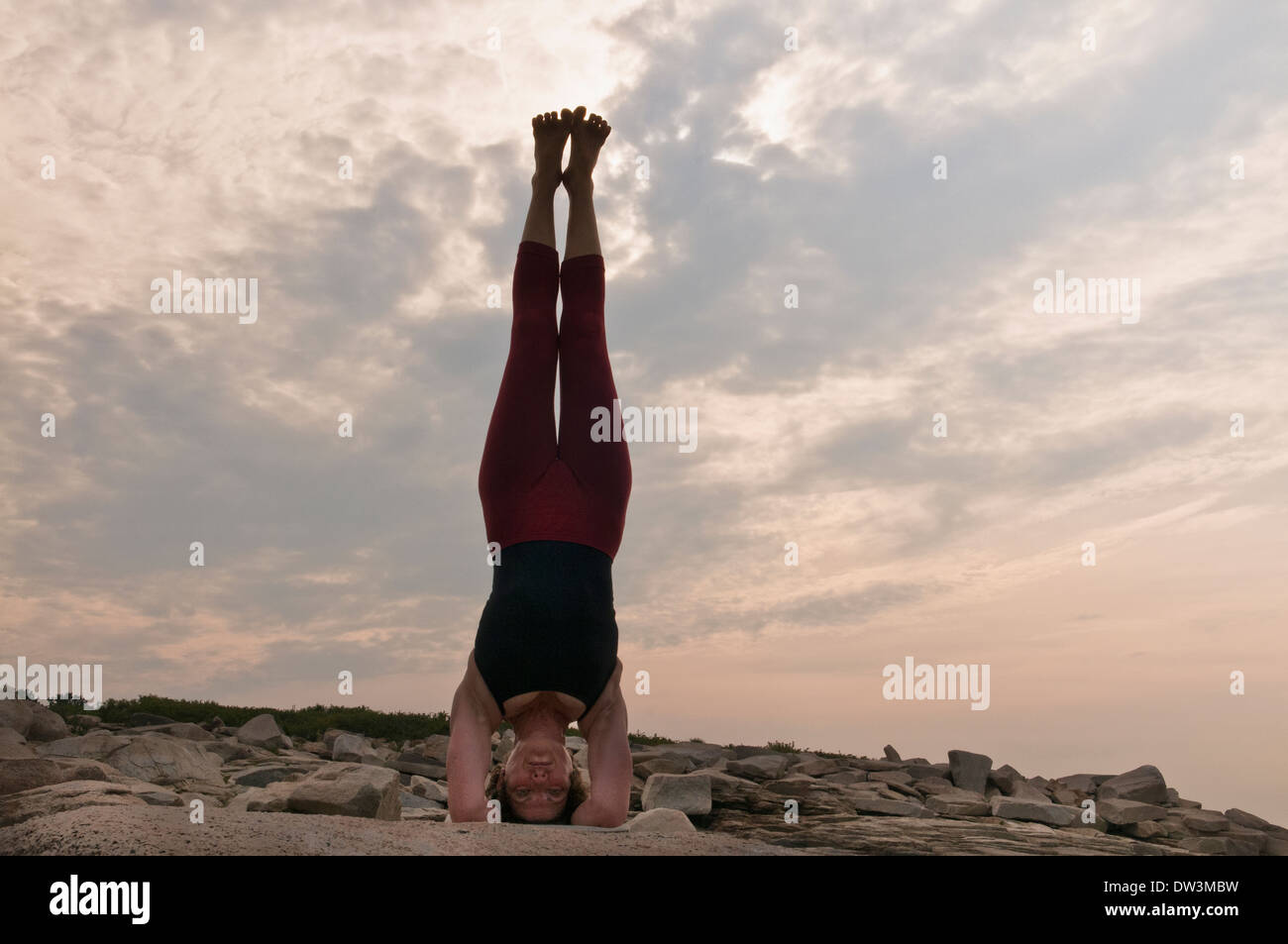 Iyengar Yoga Instructor Demonstrates Sirsasana (Inverted). Stock Photo