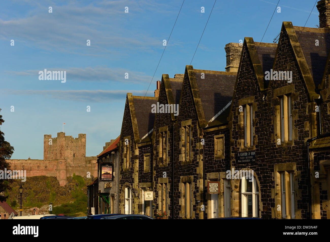 Front Street and Bamburgh Castle, Northumberland, England, UK Stock