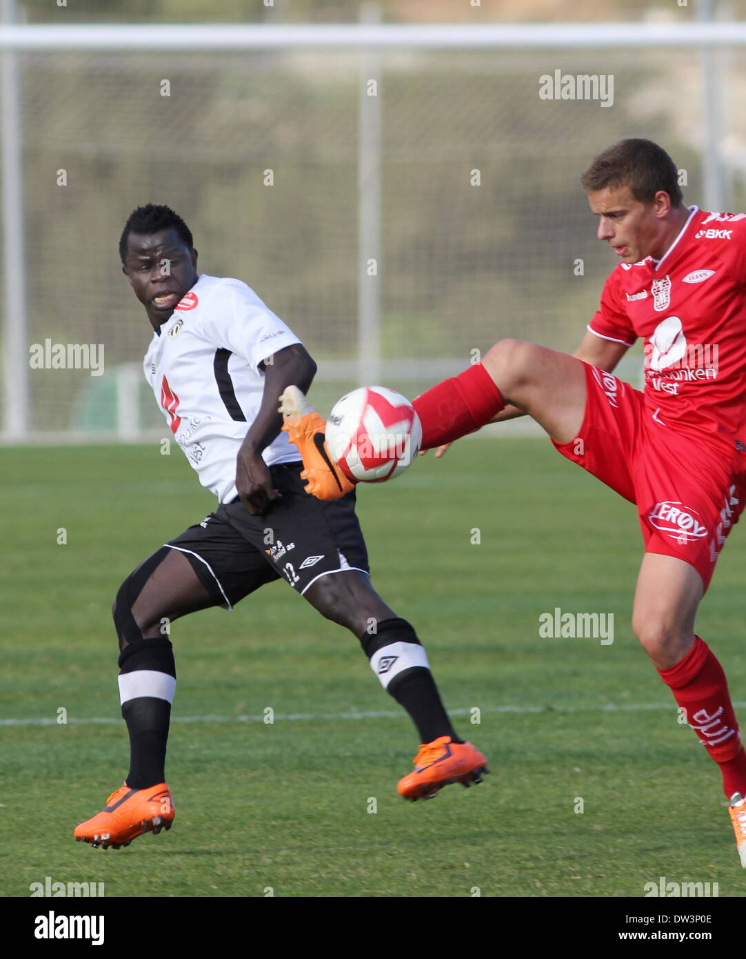 La Manga, Spain. 26th February 2014. 26 February 2014. La Manga Cup - Sogndal v Brann at la Manga Club, Spain. Norway Pre-Season Friendly Tournament.   Malick Mane (Sogndal) is beaten to the ball by Jonas Gronner (Brann)   Photo by Tony Henshaw / La Manga Photos/Alamy Live News Stock Photo