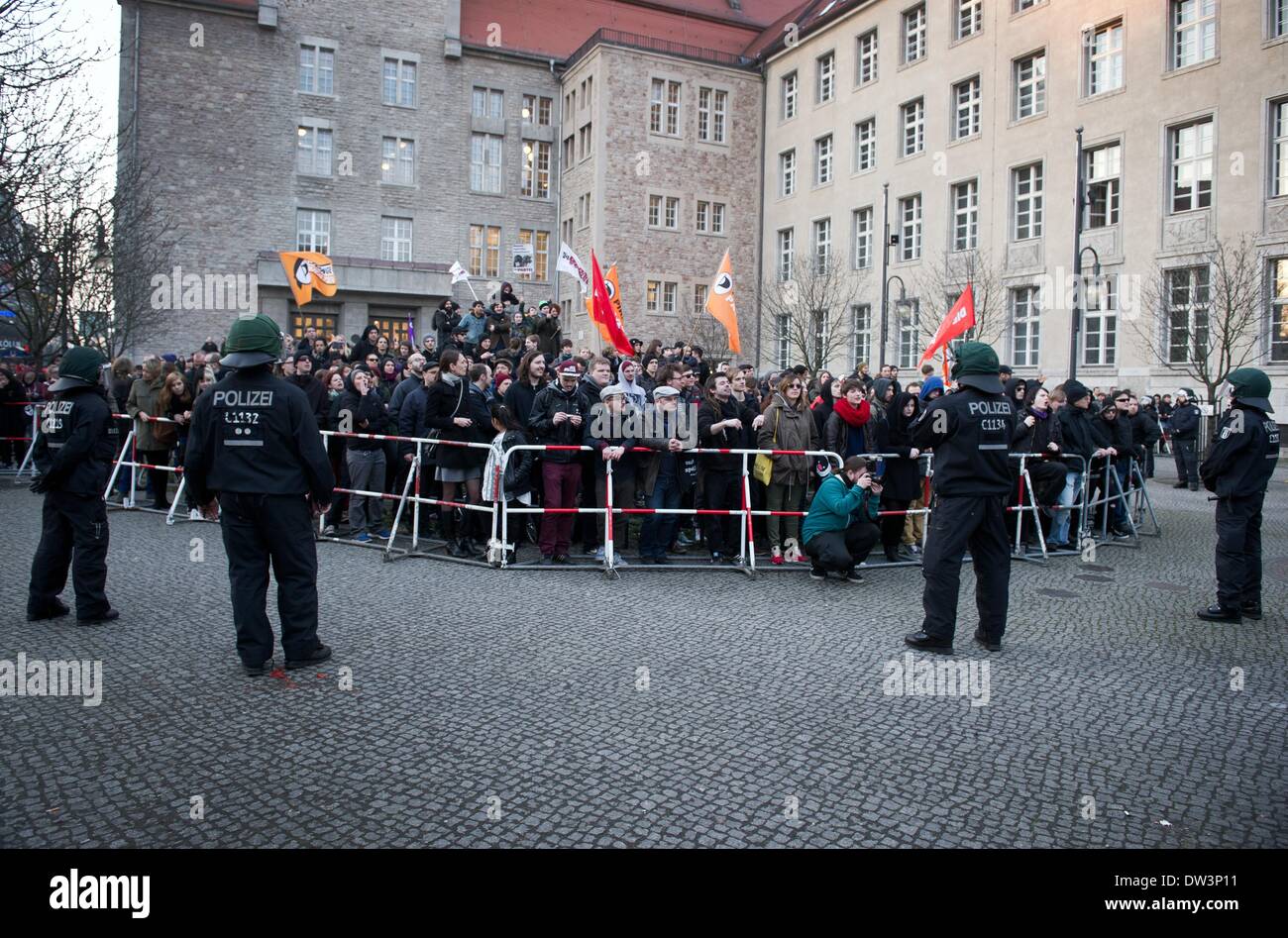 Berlin, Germany. 26th Feb, 2014. Police stand in front of counterdemonstrators during an NPD demonstration in Berlin, Germany, 26 February 2014. The NPD was protesting against the controverstial Dresden action by Pirate Party politician Anne Helm. Helm took part in a Femen protest under the motto 'Thanks Bomber Harris.' Photo: DANIEL NAUPOLD/dpa/Alamy Live News Stock Photo