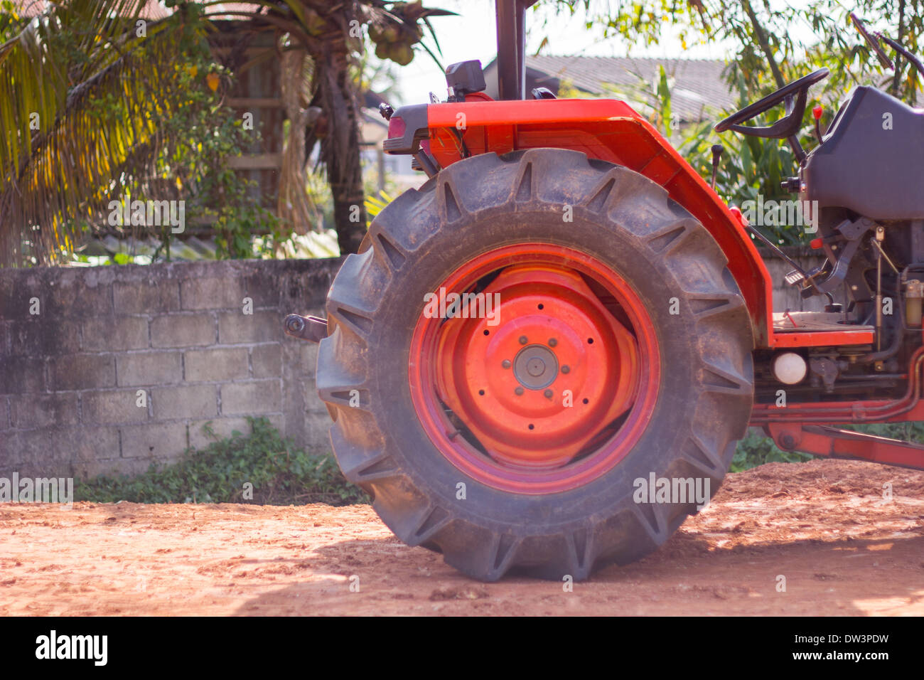 tractor wheel is orange Stock Photo - Alamy