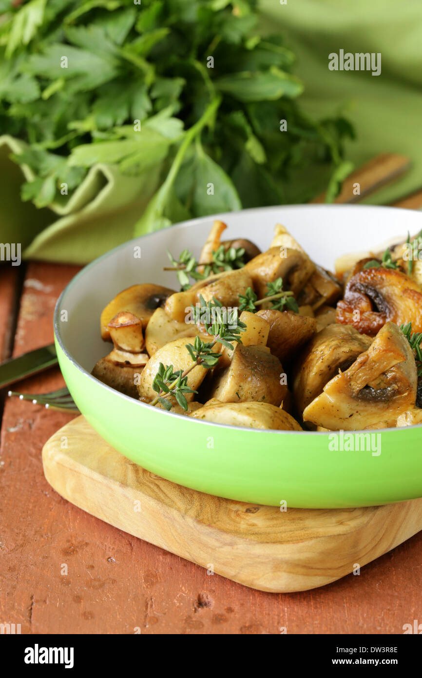 fried champignon mushrooms with thyme in a pan Stock Photo - Alamy