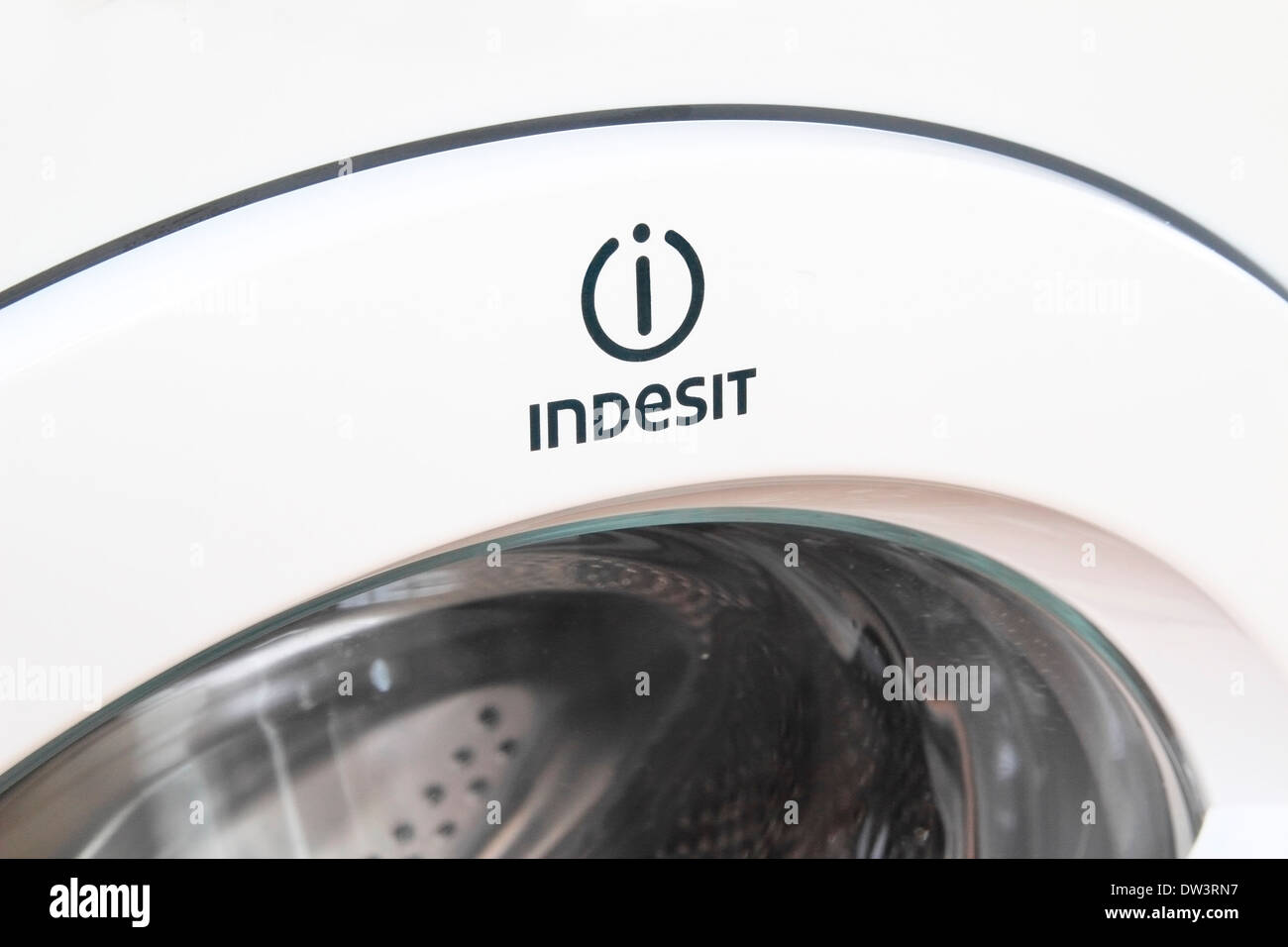 Indesit Logo on a Indesit Washing Machine Door Stock Photo