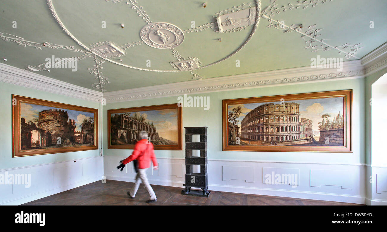 Monument conservationist Annette Scholtka views the freshly restored suite with Roman motive of Prince Johann Georg, younger brother of Prince Franz of Anhalt-Dessau at Woerlitz Palace in Woerlitz, Germany, 24 February 2014. There are six other similar suites of two rooms in the palace commissioned by Prince Leopold Friedrich Franz von Anhalt-Dessaut. They are being restored until 2016. The rooms were used by the prince and his family as well as Marshall Berenhorst and the architect Erdmanndorff. The palace is part of the UNESCO World Cultural Heritage and is an example of German neo-classicis Stock Photo