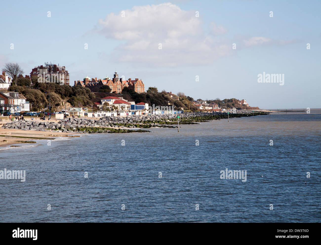 Rock armour sea defences and historic buildings on the seafront on a sunny day in winter at Felixstowe, Suffolk, England Stock Photo