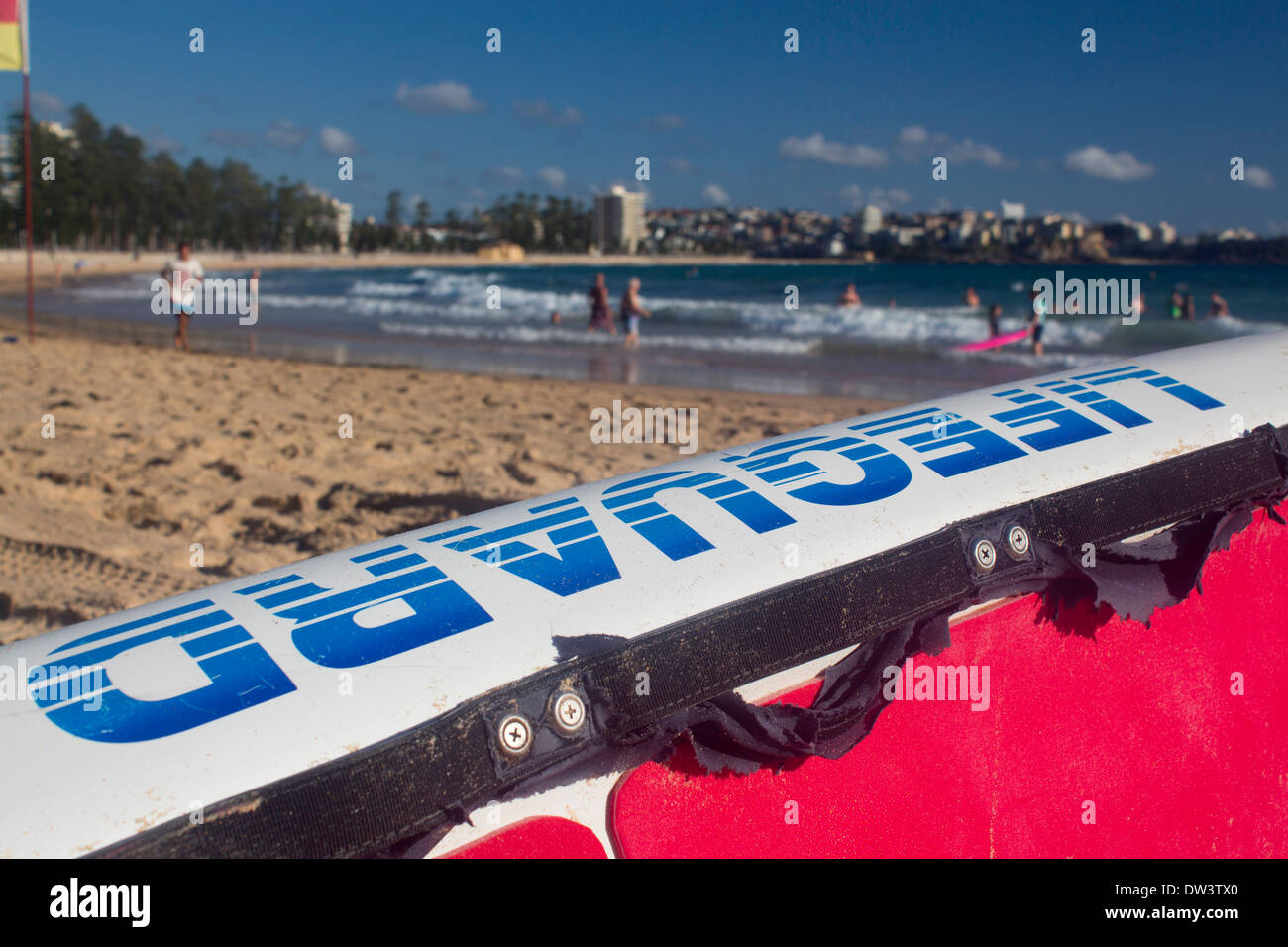 Manly North Steyne Beach with lifeguard surfboard in foreground