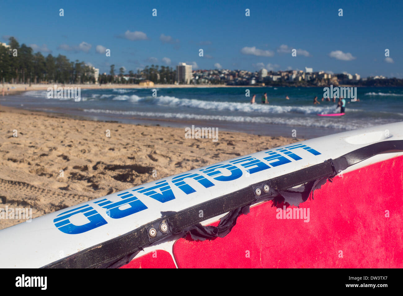Manly North Steyne Beach with lifeguard surfboard in foreground