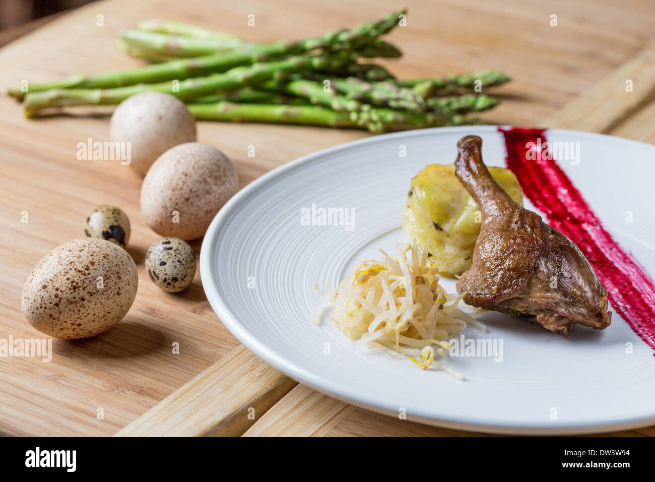Roasted leg of duck with bean sprouts and potato with cheese Stock Photo