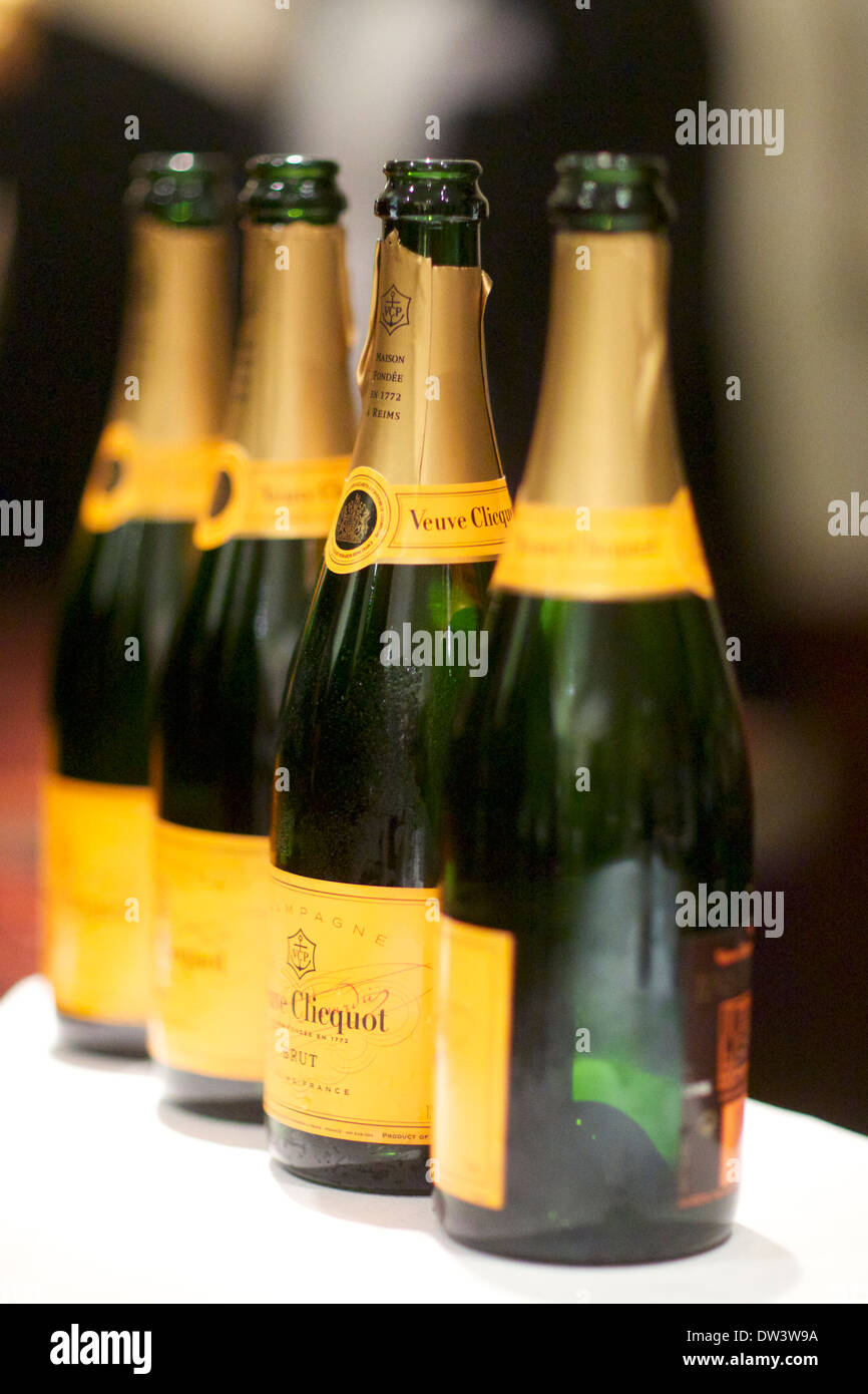 Champagne bottles lined up ready for drinking during a function Stock Photo