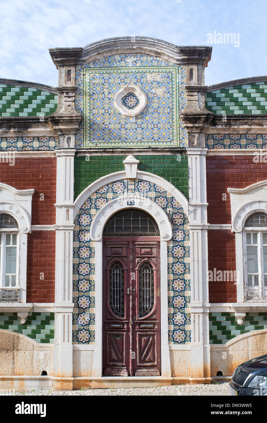 Decorative green tiles around a doorway into a house in Faro, Portugal, Europe Stock Photo